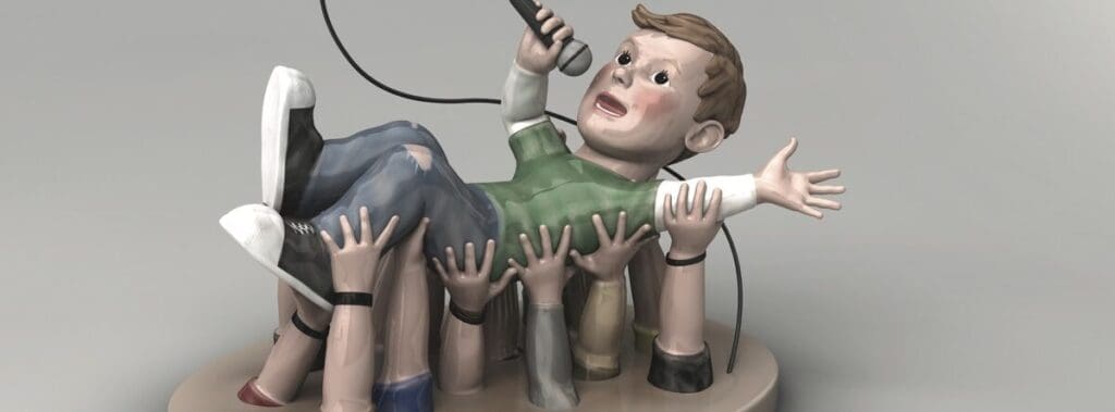 A claymation figure being lifted by multiple hands holding microphones.